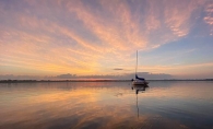 A sailboat at sunset on White Bear Lake