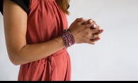 A woman models clothing from fashion nonprofit 3seams.