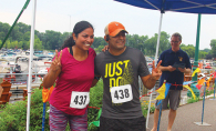 Two people participate in the Rotary Club of White Bear Lake's Strive scholarship run.