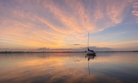 Swirling, sun-kissed clouds make for a serene, award-winning photo.  