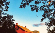 The sun shines on the Hill Farm Historical Society granary.
