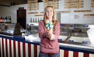 Jaime Tegdesch serves up a cone full of Superman hard-serve ice cream at Ozzie’s. Yum!