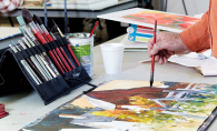 Artist Frank Zeller paints a watercolor at the White Bear Center for the Arts