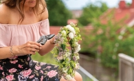 A woman makes a flower crown.