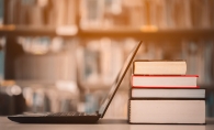 A laptop donated to the White Bear Lake Rotary Club Technology Drive rests against some books.