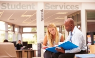 A student speaks with a support specialist at the Century College Resource and Support Center