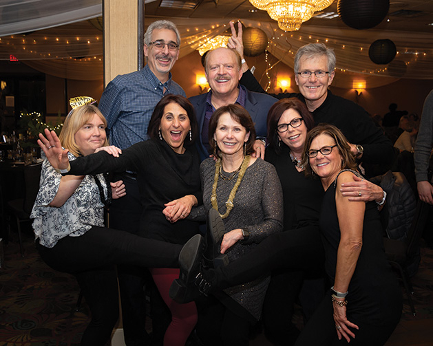 A group of friend pose for a photo at the Rudy's Redeye Grill New Year's Eve celebration.