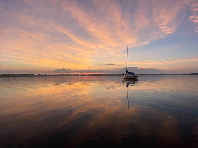 A sailboat at sunset on White Bear Lake