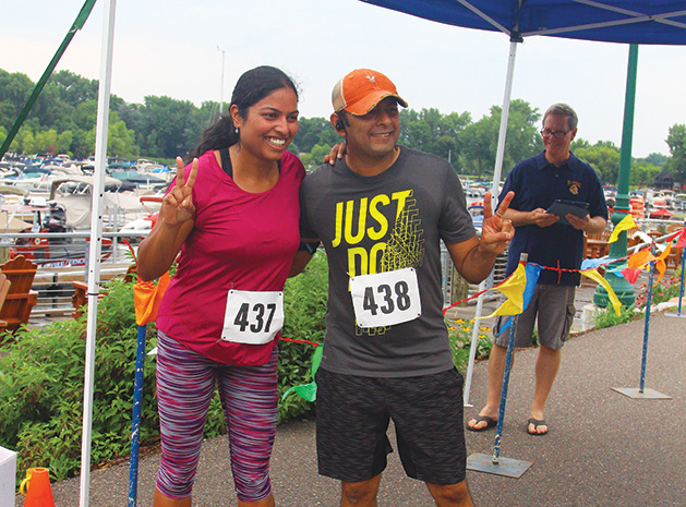 Two people participate in the Rotary Club of White Bear Lake's Strive scholarship run.