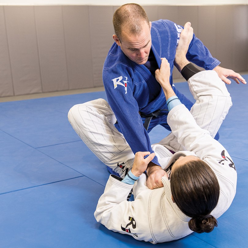 Chris and Anna Golv demonstrating jiu-jitsu moves. 