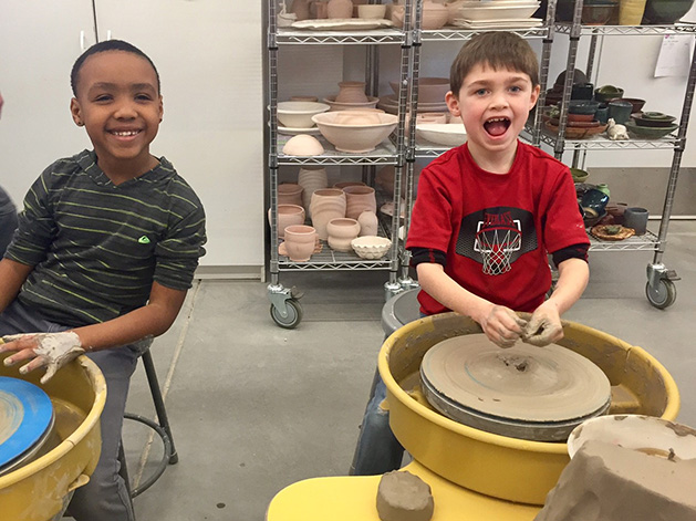 Two kids at a pottery class at White Bear Center for the Arts